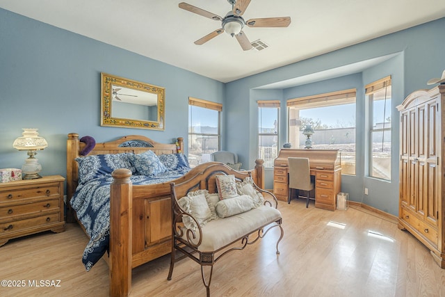 bedroom with ceiling fan and light hardwood / wood-style floors