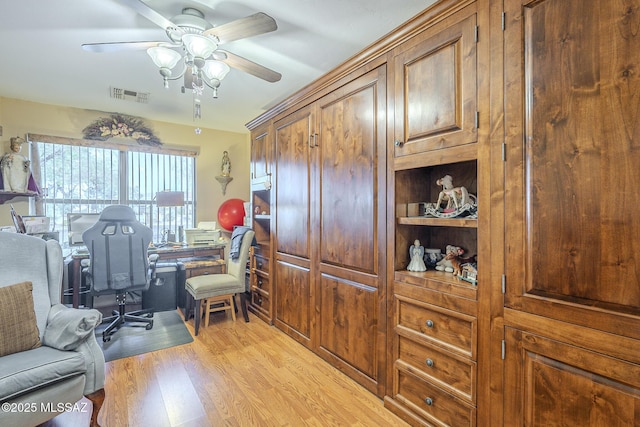 office featuring ceiling fan and light hardwood / wood-style flooring