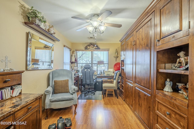 office area with ceiling fan and light hardwood / wood-style flooring