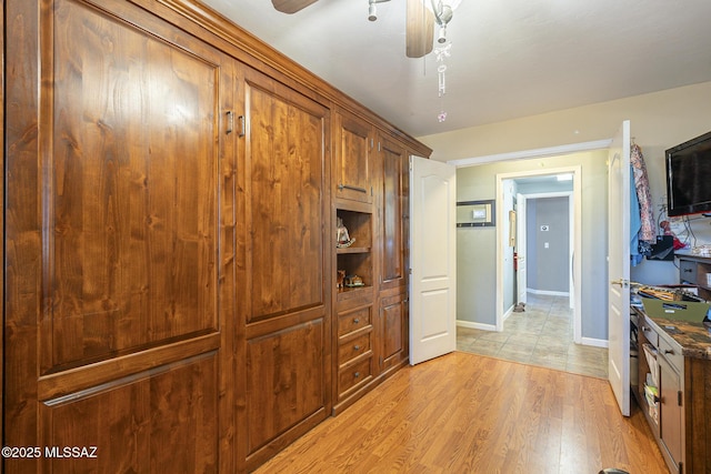 kitchen with ceiling fan and light hardwood / wood-style floors