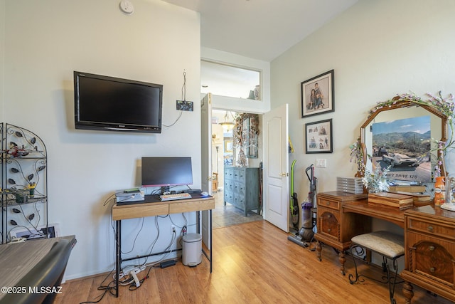 office area with light hardwood / wood-style floors