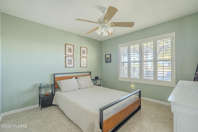 bedroom with light tile patterned floors and ceiling fan