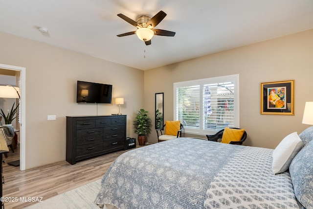 bedroom featuring a ceiling fan and light wood-type flooring