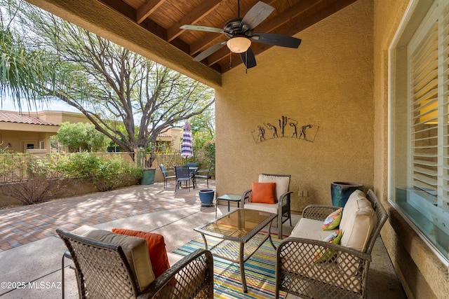 view of patio / terrace with outdoor dining space, a ceiling fan, and fence