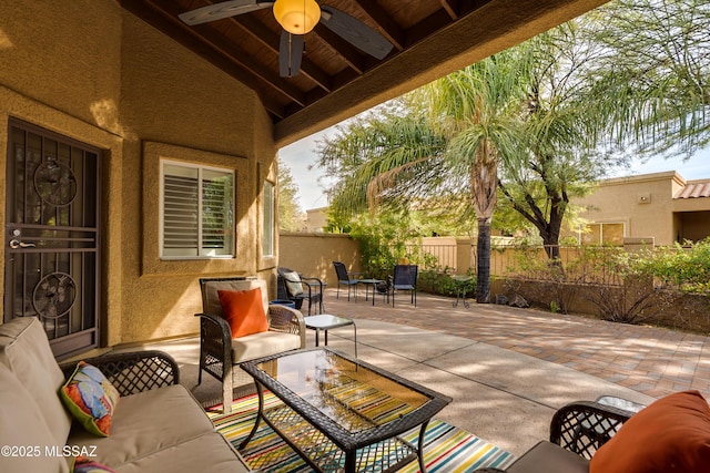 view of patio / terrace featuring outdoor lounge area, a fenced backyard, and ceiling fan