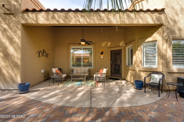 view of patio featuring an outdoor hangout area and a ceiling fan