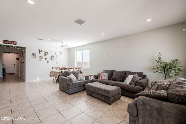 tiled living room featuring ceiling fan