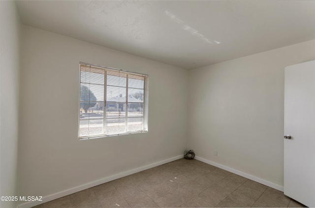 empty room with baseboards