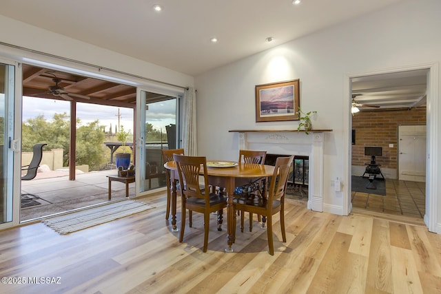 dining space with lofted ceiling, recessed lighting, light wood finished floors, and ceiling fan