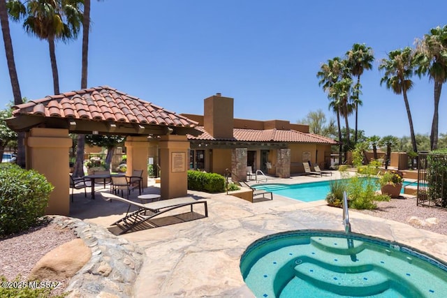 view of pool with a gazebo and a patio