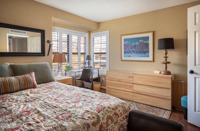 bedroom featuring dark hardwood / wood-style floors