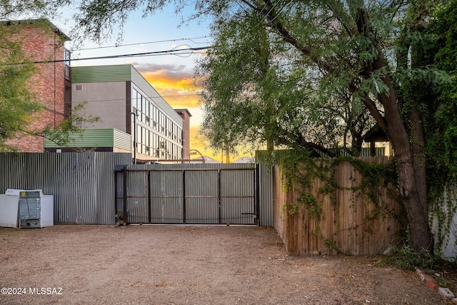 view of gate featuring fence