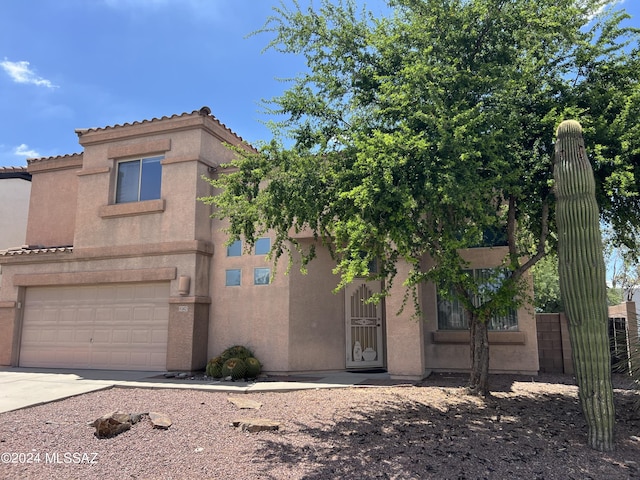 view of front of home with a garage