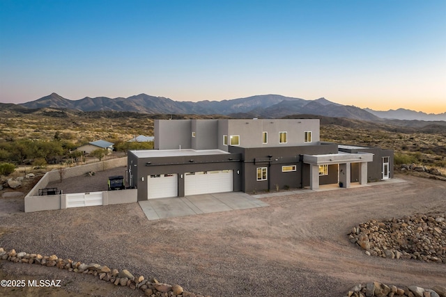 view of front of home featuring a garage and a mountain view