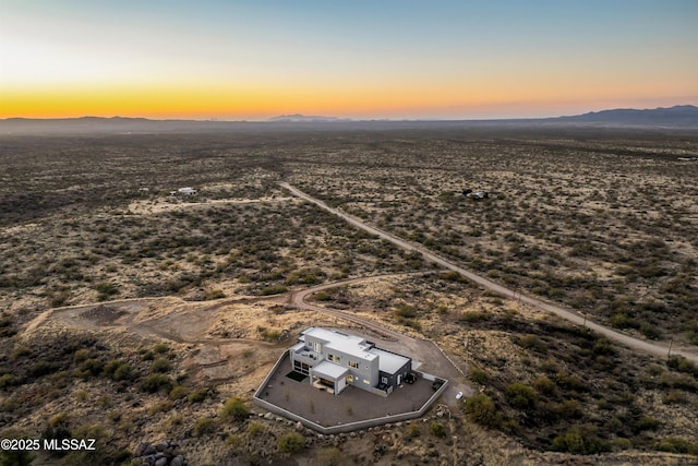 aerial view at dusk with a mountain view