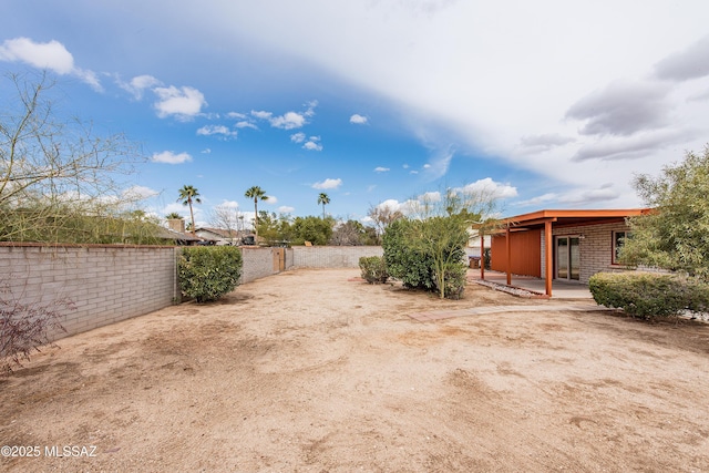 view of yard featuring a patio area and fence