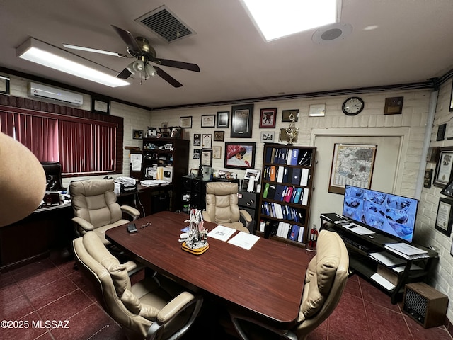 office space with visible vents, a ceiling fan, dark tile patterned flooring, ornamental molding, and a wall mounted AC