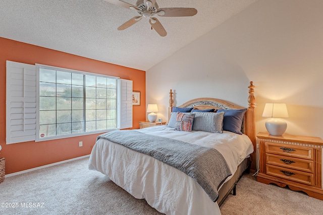 bedroom with lofted ceiling, light carpet, ceiling fan, a textured ceiling, and baseboards