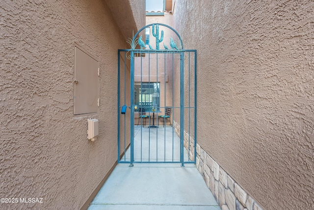 doorway to property featuring stucco siding