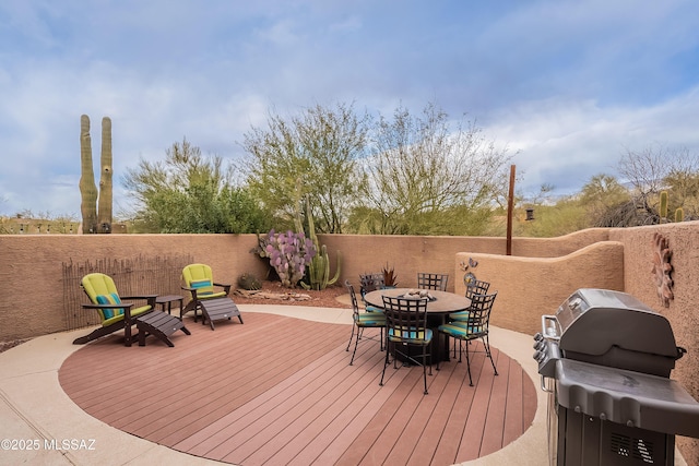 wooden terrace featuring fence and area for grilling