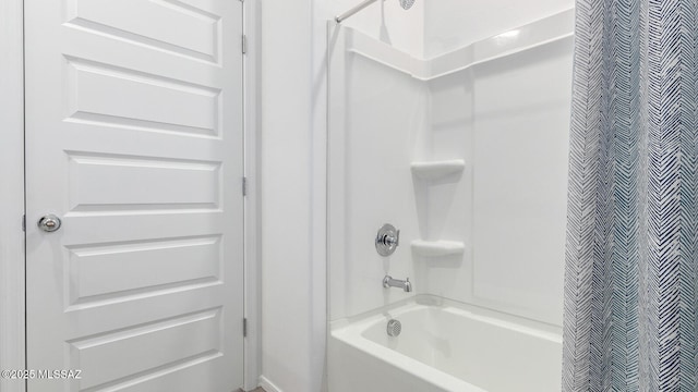 bathroom featuring shower / bathtub combination with curtain