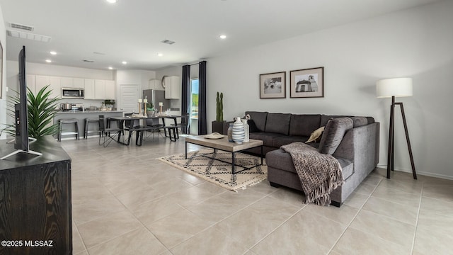 living room with light tile patterned floors