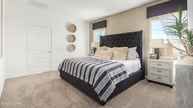 bedroom with light colored carpet