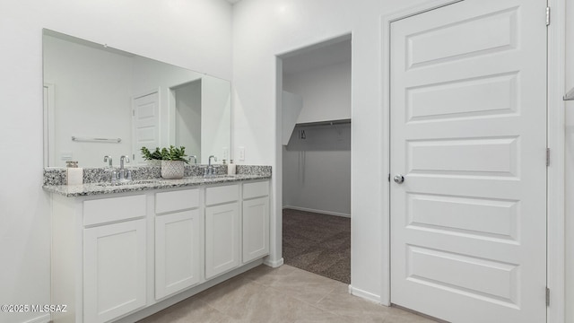 bathroom with vanity and tile patterned floors