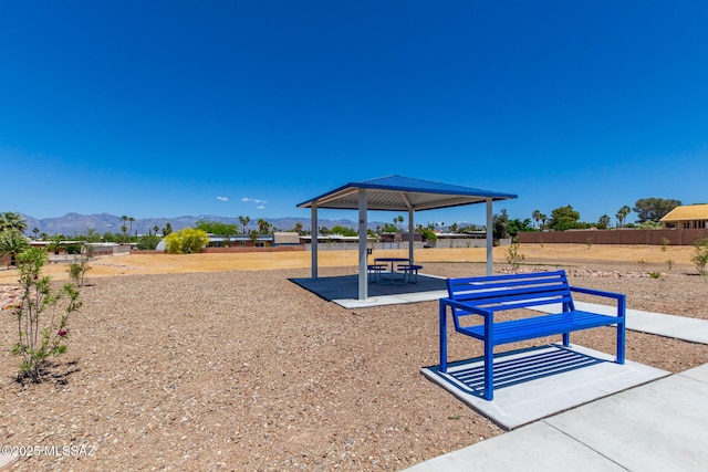 surrounding community with a mountain view, a gazebo, and a patio