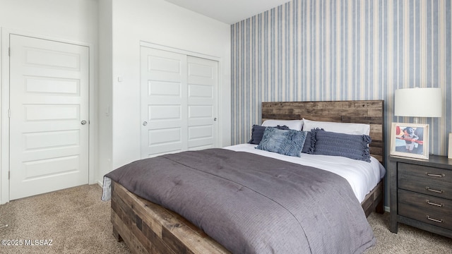 bedroom featuring light carpet and a closet