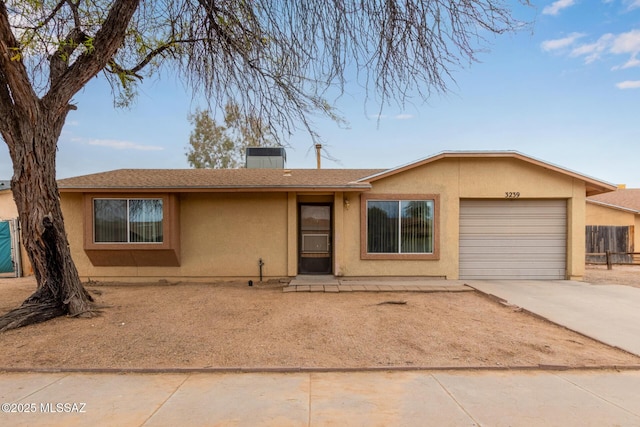 ranch-style house featuring a garage