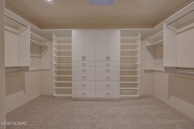 bedroom featuring ceiling fan, access to exterior, a multi sided fireplace, carpet, and a mountain view