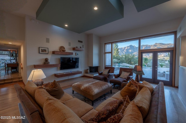 living room featuring hardwood / wood-style flooring and french doors