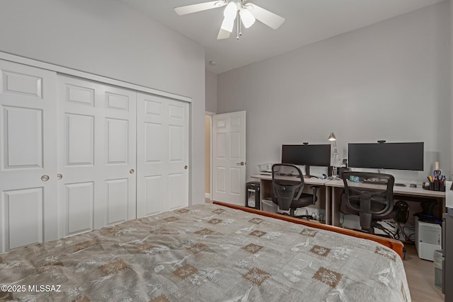 bedroom with vaulted ceiling, a closet, and ceiling fan