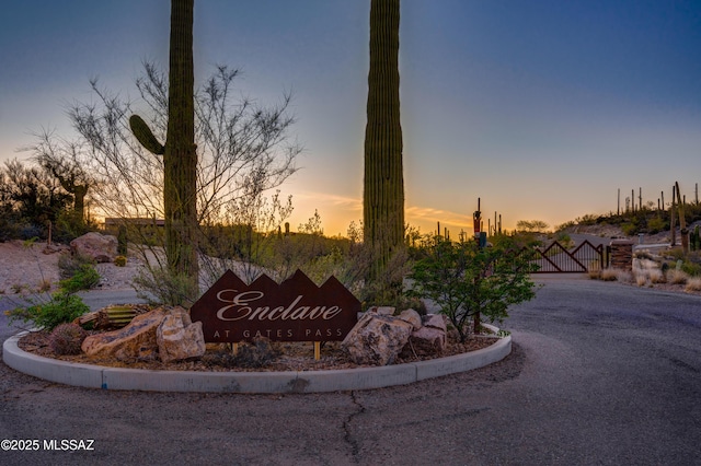 community sign featuring a gate