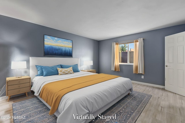 bedroom featuring light wood-type flooring