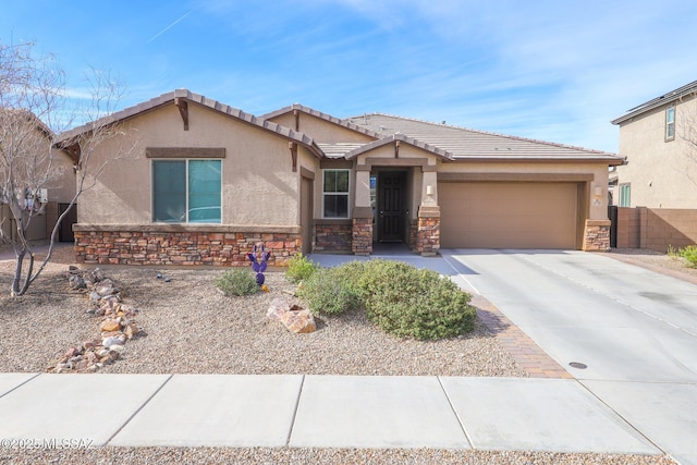 ranch-style house with stucco siding, an attached garage, concrete driveway, and stone siding