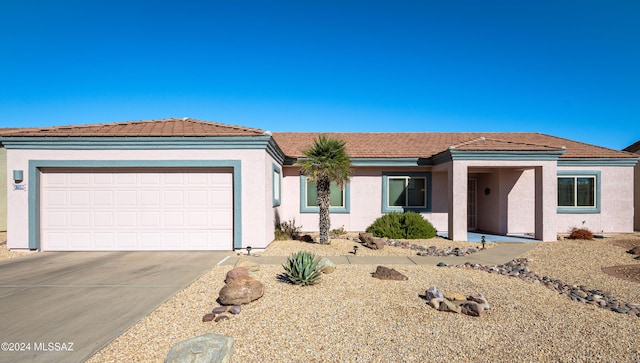 single story home featuring a garage