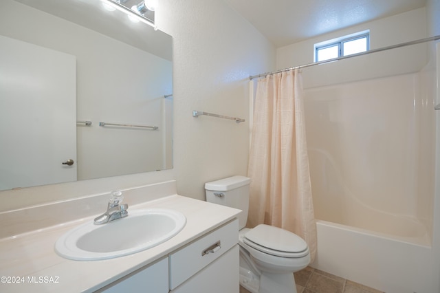 full bathroom with tile patterned flooring, vanity, shower / tub combo, and toilet