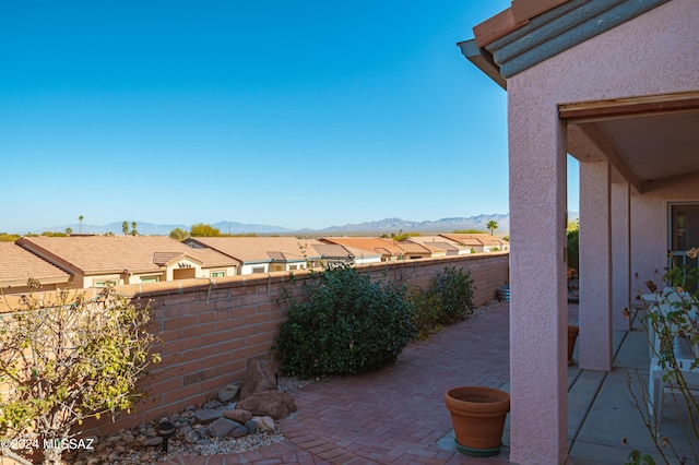 view of patio / terrace with a mountain view