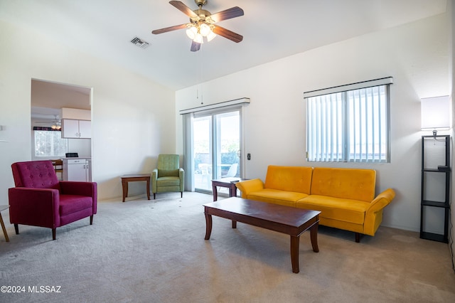 living room featuring light carpet and ceiling fan