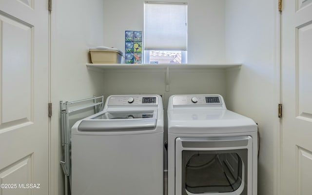 washroom with independent washer and dryer