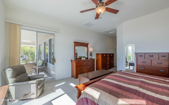 bedroom featuring multiple windows, light carpet, access to exterior, and ceiling fan