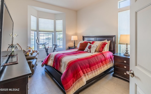 bedroom featuring light tile patterned floors