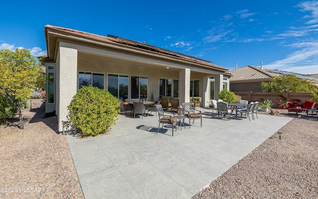 rear view of property featuring a patio area