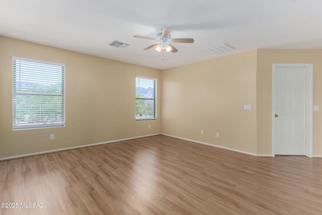 12996 N Desert Olive Dr, Oro Valley, AZ 85755 - spare room with ceiling fan and light hardwood / wood-style floors