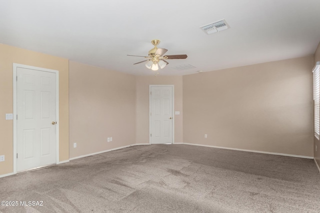 12996 N Desert Olive Dr, Oro Valley, AZ 85755 - spare room featuring ceiling fan and carpet flooring
