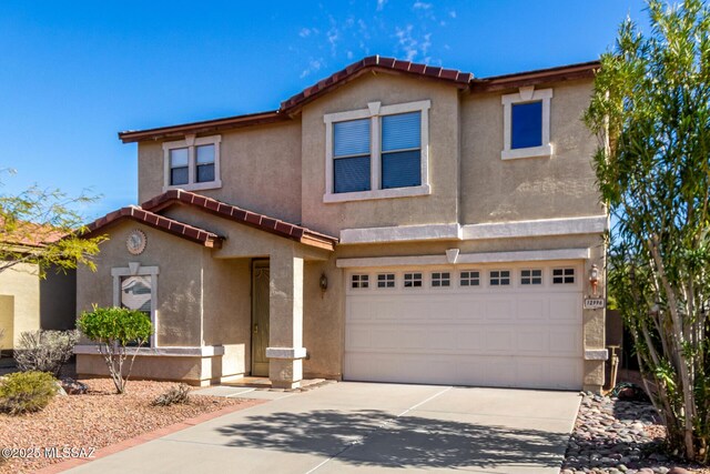 12996 N Desert Olive Dr, Oro Valley, AZ 85755 - view of front of house with a garage
