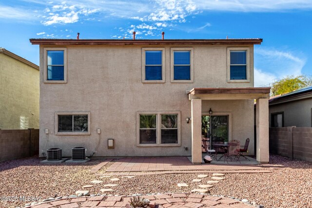 12996 N Desert Olive Dr, Oro Valley, AZ 85755 - rear view of house with central AC and a patio
