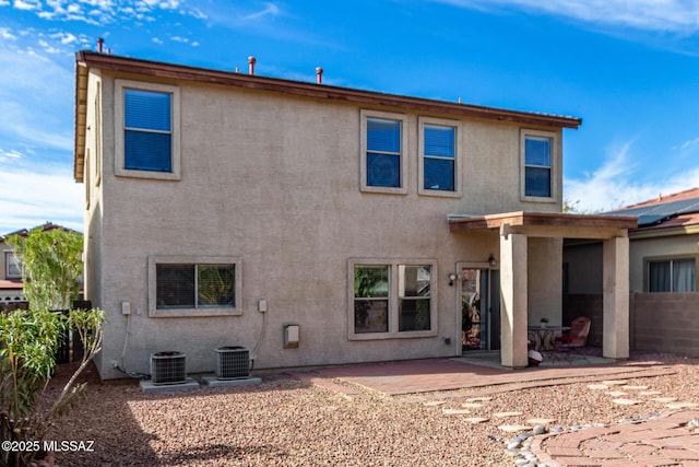 12996 N Desert Olive Dr, Oro Valley, AZ 85755 - back of house featuring central AC unit and a patio area